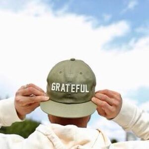 All organic cotton  green hat from Cafe Gratitude. Too big for me. Never worn.